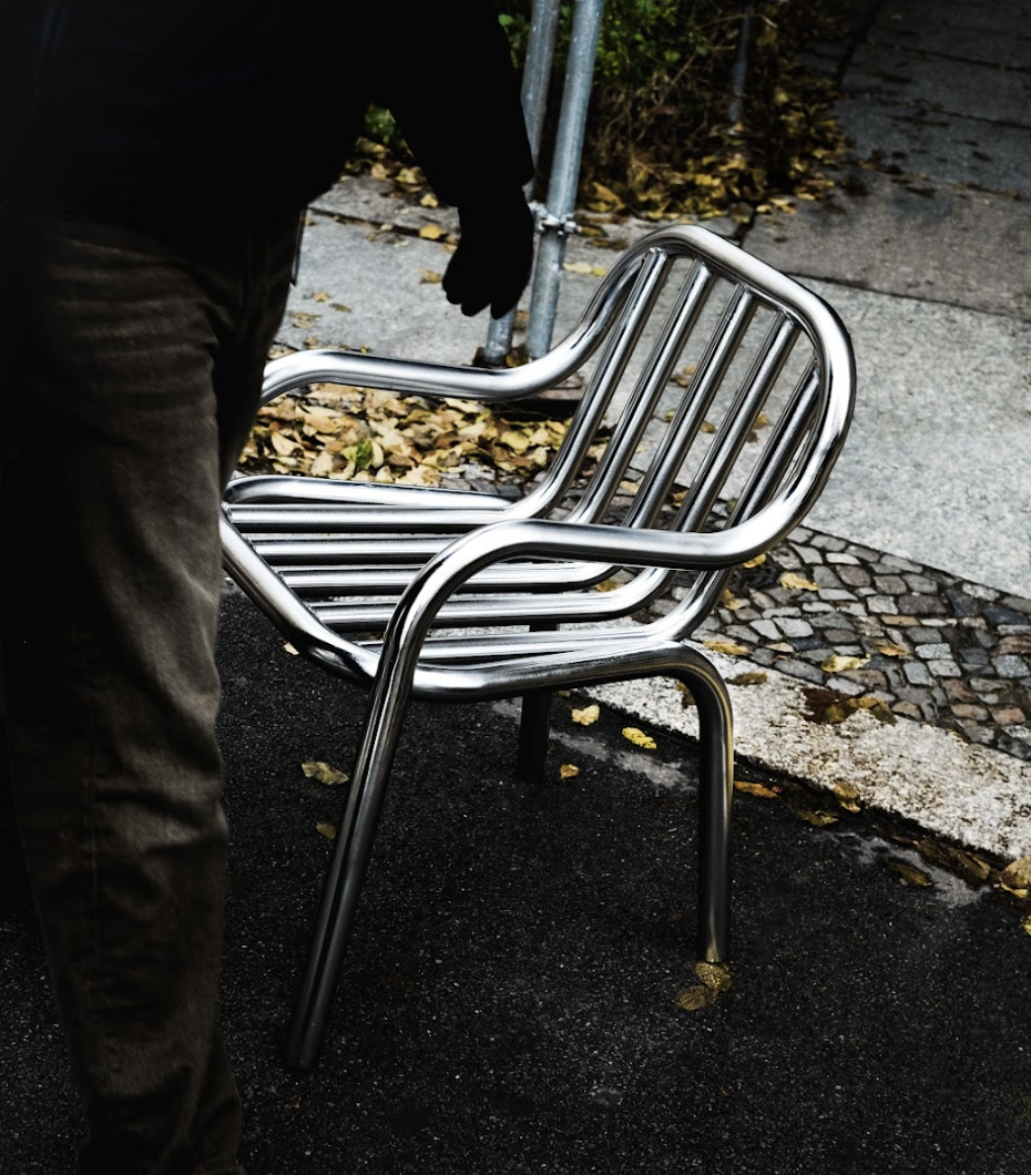 A sleek and modern outdoor furniture set featuring a white composite material construction with a grey metal frame. Perfect for adding a contemporary touch to any outdoor space.